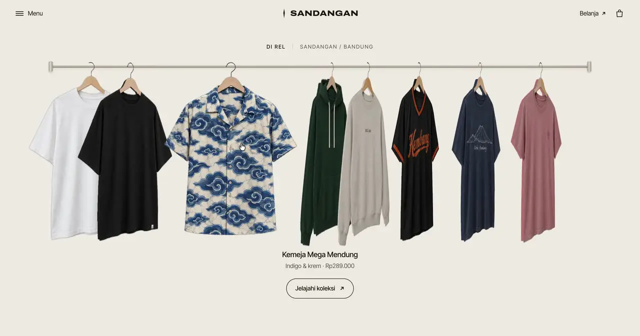 Halaman website SANDANGAN yang dibuat AI: baju tergantung di rel